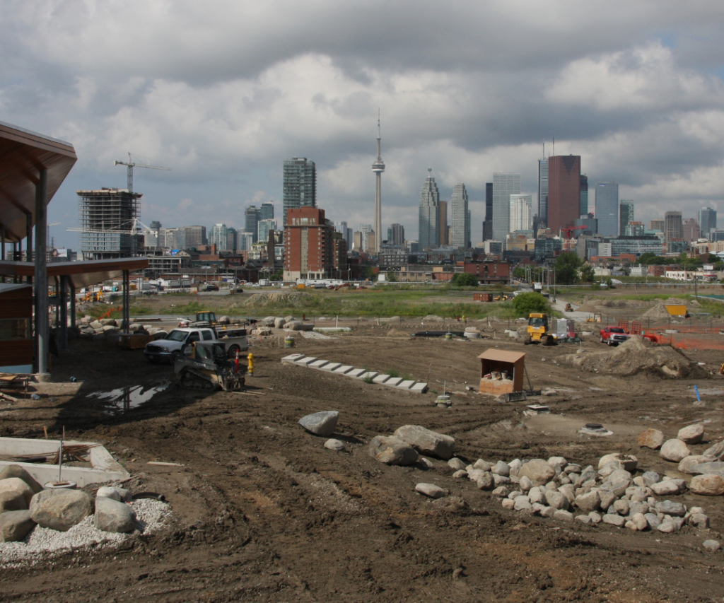About Us Page - Delivering of aggregates in the heart of Toronto with a view of the CN Tower in the background
